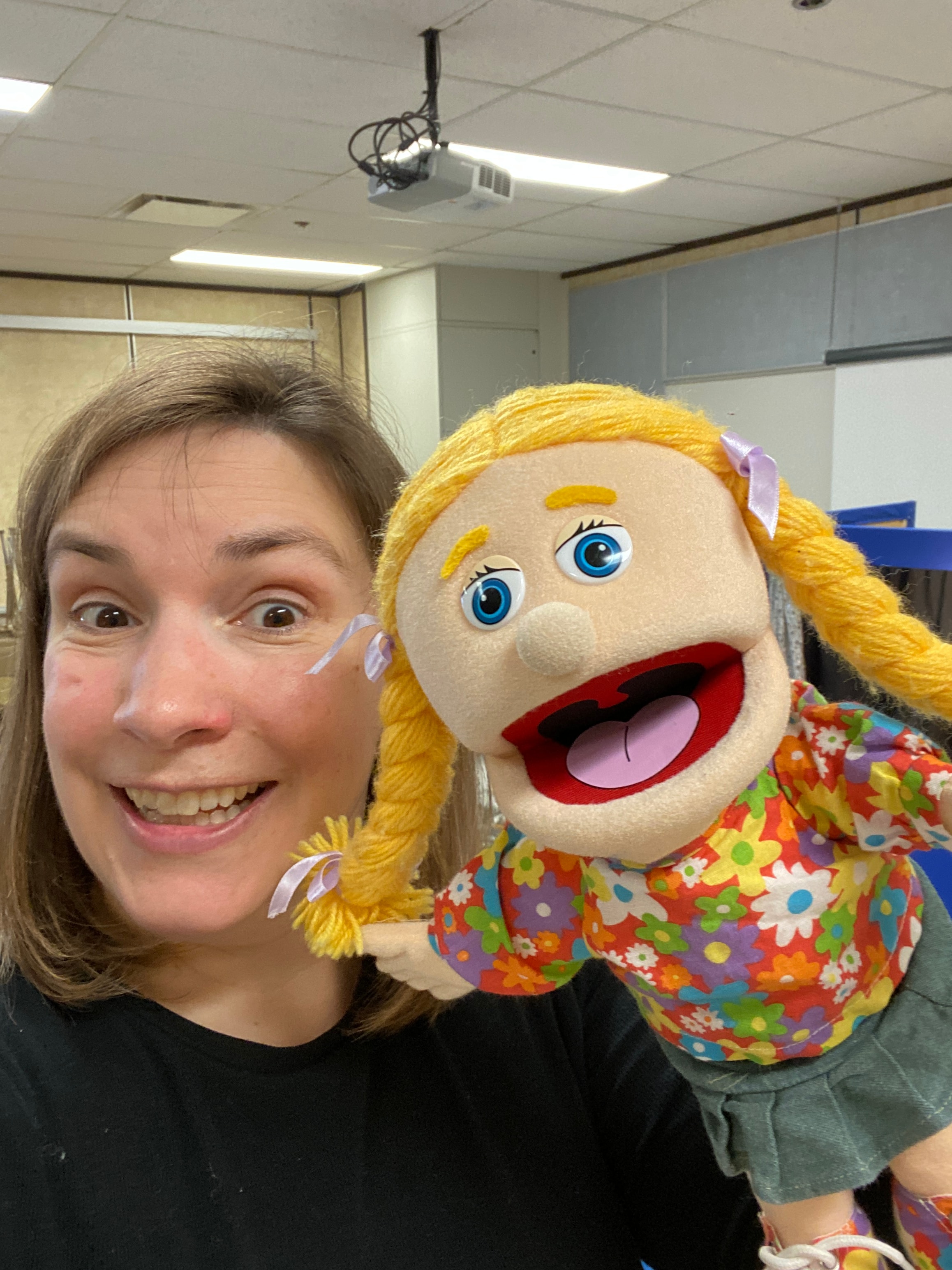 Children engaged in a puppet workshop at school